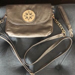 Gray crossbody purse with gold accents